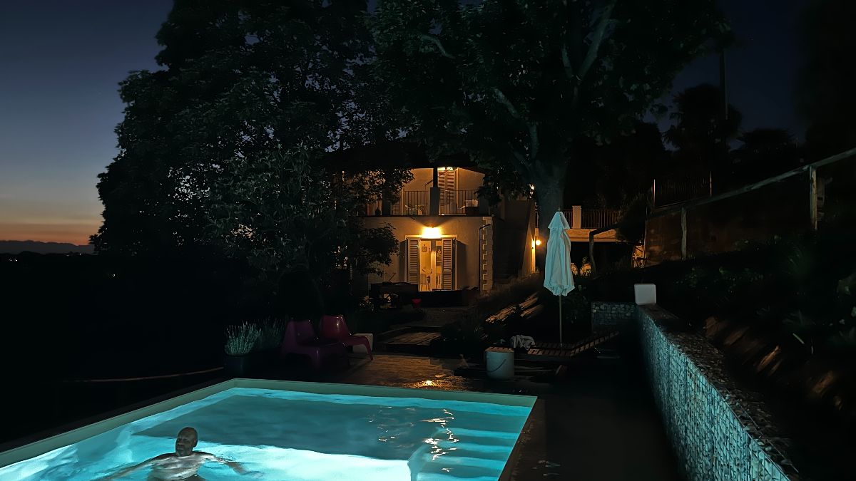 Pool and house at night