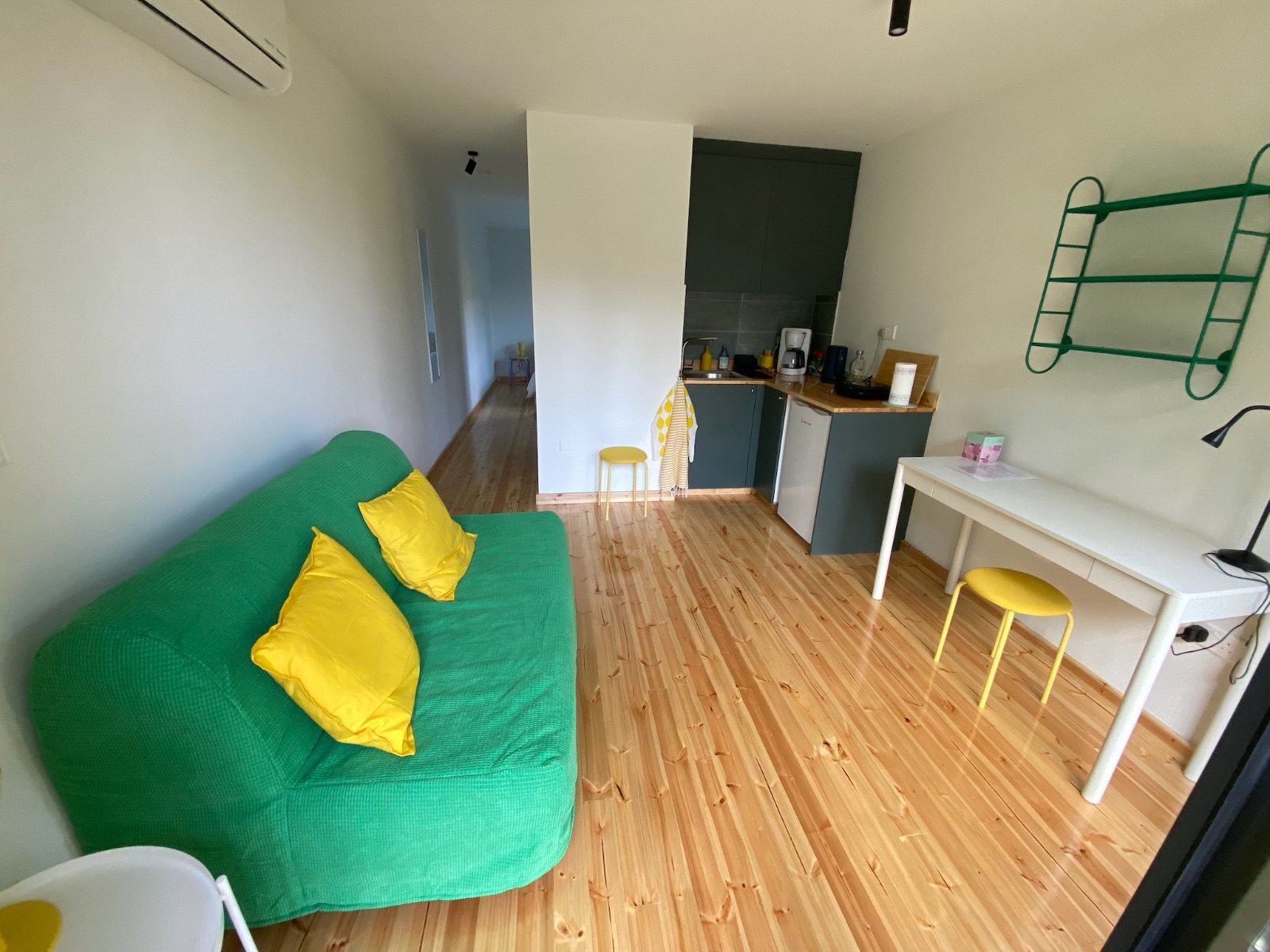 Lounge of one of the apartments with sofa bed for one or two.