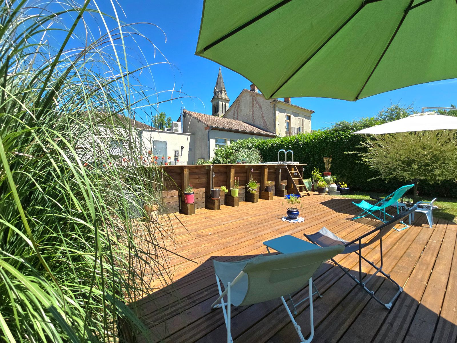 Salon donnant dans la Véranda côté jardin Salon donnant dans la Véranda côté jardin