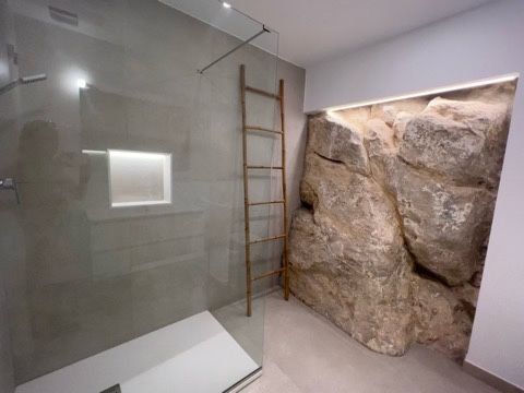 Master bathroom with rock art