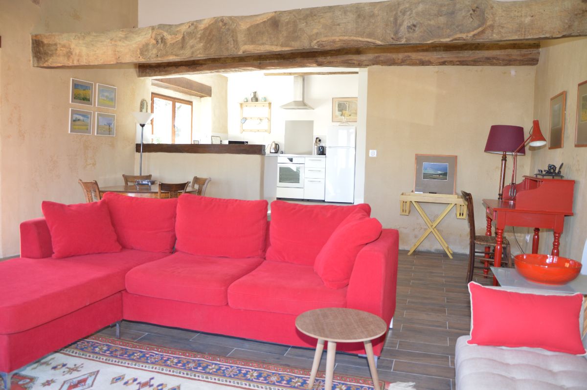 Large, open plan living are with ancient, exposed beams